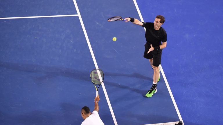 Andy Murray of Britain hits a smash against Nick Kyrgios of Australia  in their men's singles match on day nine of the 2015 Australian Open tennis 