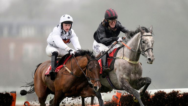Arabian Revolution ridden by jockey Tony McCoy (right) jumps the last ahead of Rathealy riddny by Michael Heard to go on and win the 32Red On The App Store