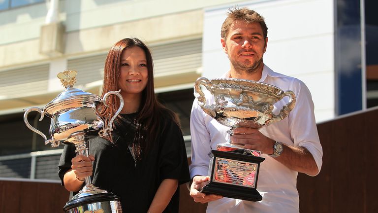 Na Li of China and Stan Wawrinka of Switzerland pose with the Daphne Akhurst Memorial Cup and Norman Brookes Challenge Cup, Australian Open draw, Melbourne