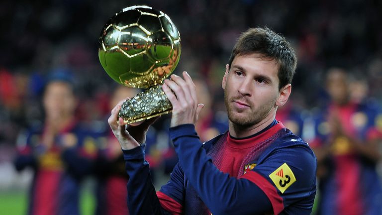 Lionel Messi with the Ballon d'or