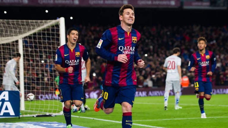 Lionel Messi of FC Barcelona celebrates after scoring his team's first goal during the Copa del Rey QF Leg 1 v Atletico