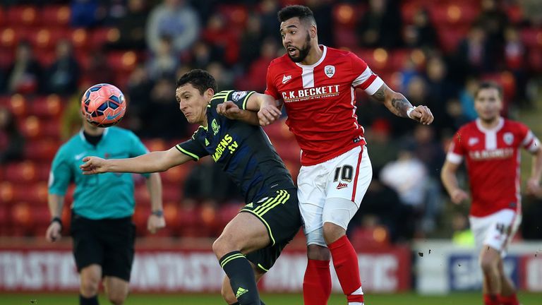 Kane Hemmings of Barnsley battles with Milos Veljkovic of Middlesbrough during the FA Cup Third Round match