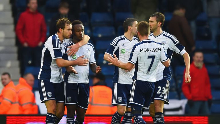 Saido Berahino celebrates with team mates as he scores their first goal during the FA Cup Third Round match between West Bromwich Albion and Gateshead