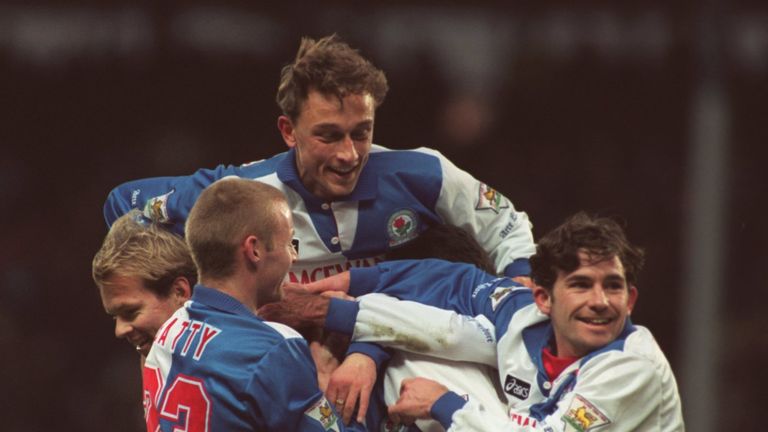 ALAN SHEARER IS ENGULFED BY BLACKBURN ROVERS PLAYERS CELEBRATING SHEARER's 100th GOAL FOR THE CLUB DURING THE PREMIER LEAGUE