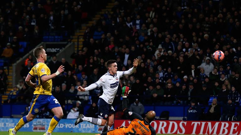 BOLTON, ENGLAND - JANUARY 03: Zach Clough of Bolton scores the opening goal during the FA Cup Third Round match Wigan