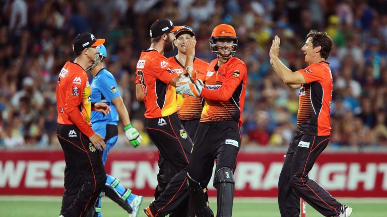 Brad Hogg and his Perth teammates celebrate another wicket.