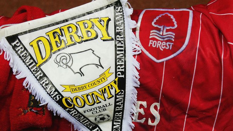 DERBY, ENGLAND - OCTOBER 21:  Fans pay their respects as they lay scarfs during The Memorial Service for Brian Clough at Pride Park on October 21, 2004 in 