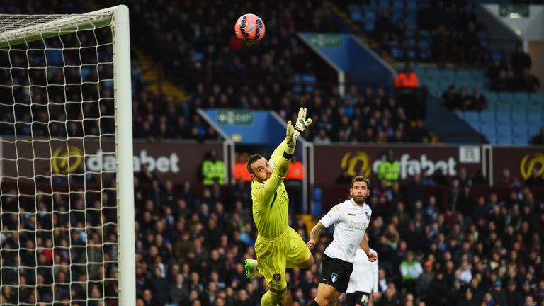 BIRMINGHAM, ENGLAND - JANUARY 25: Lee Camp of Bournemouth fails to stop the shot by Carles Gil of Aston Villa for the opening goal during the FA Cup Fourth