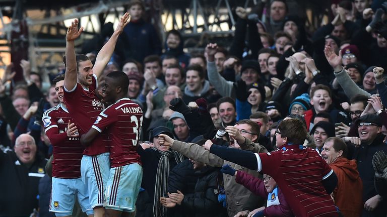 West Ham United's English striker Andy Carroll celebrates with teammates 