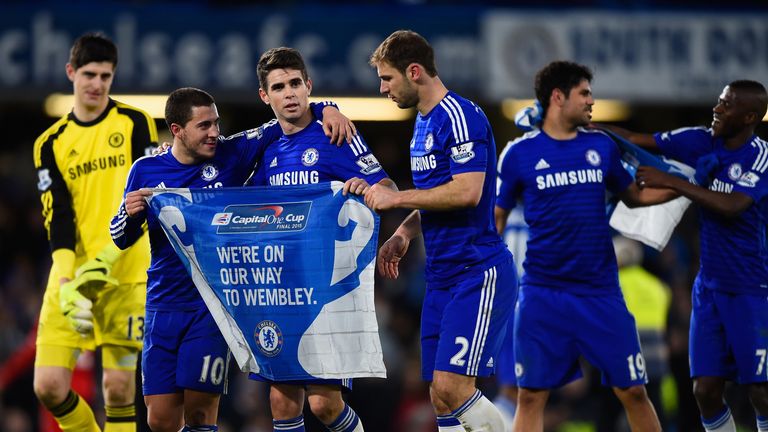 Eden Hazard, Oscar and Branislav Ivanovic of Chelsea celebrate victory in the Capital One Cup Semi-Final second leg between Chelsea and Liverpool