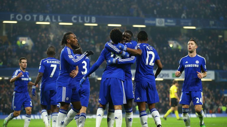LONDON, ENGLAND - JANUARY 04:  Loic Remy of Chelsea (18) is congratulated by Kurt Zouma (5) and team mates as he scores their second goal during the FA Cup