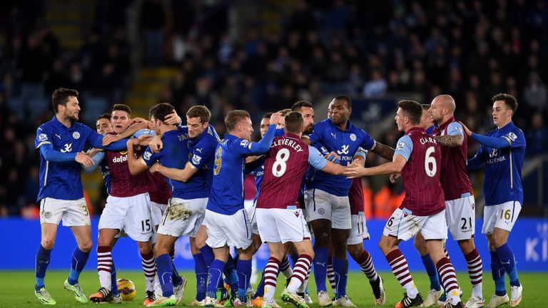 Ciaran Clark #6 of Aston Villa and Matthew James of Leicester City clash following a rash tackle on Jores Okore