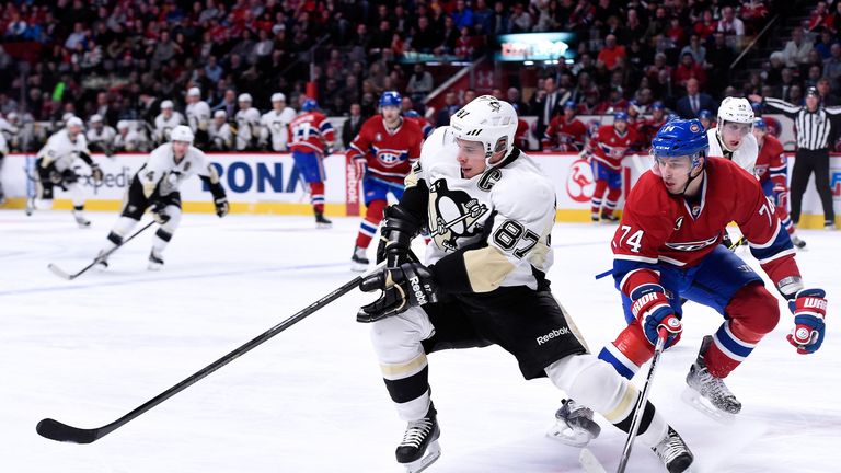 Pittsburgh Penguins star Sidney Crosby eludes Alexei Emelin of the Montreal Candiens. 