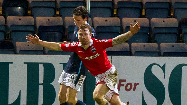 Craig Curran: The Ross County debutant wheels away after his equaliser against Dundee.
