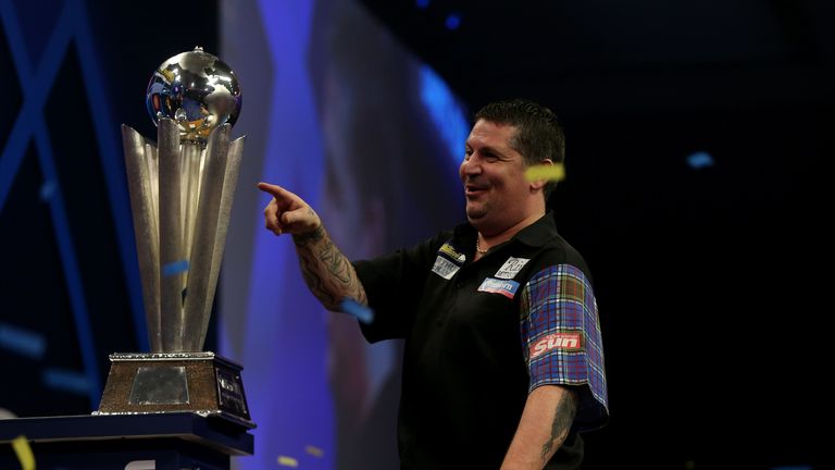 Gary Anderson celebrates with the Sid Waddell trophy