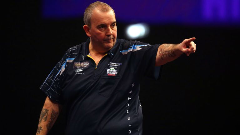 Phil Taylor celebrates winning a set during his third round match against Kim Huybrechts