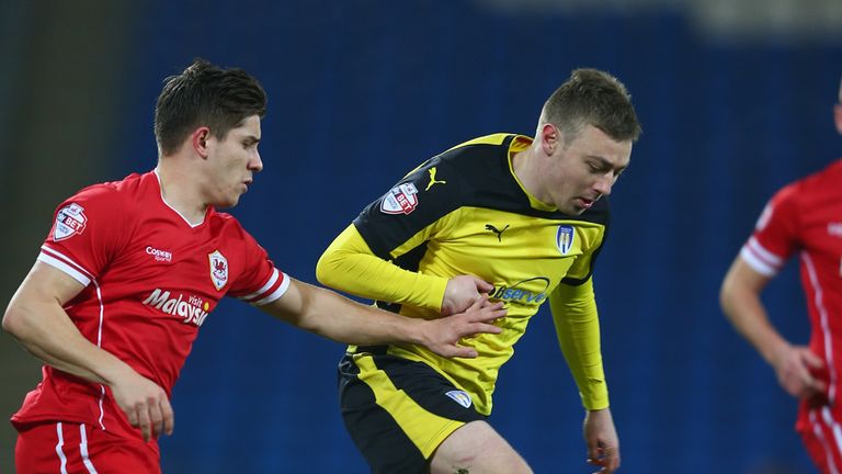 CARDIFF, WALES - JANUARY 02: Freddie Sears (R) of  Colchester is chased by Declan John of Cardiff during the FA Cup Third Round match between  Cardiff City