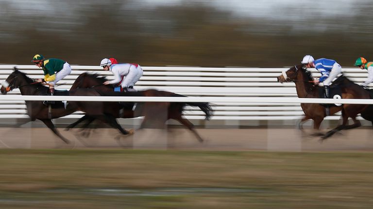 CHELMSFORD, ENGLAND - JANUARY 11: Nicky Mackay riding Zamoura (L, white) on their way to winning The SIS Maiden Fillies' Stakes at Chelmsford City racecour