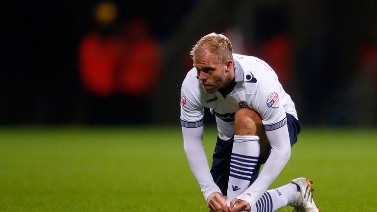 Eidur Gudjohnsen of Bolton ties his boot laces during the FA Cup Third Round match between Bolton Wanderers and Wigan Athletic