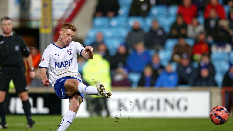 SCUNTHORPE, ENGLAND - JANUARY 06:  Eoin Doyle of Chesterfield scores a goal from the penalty spot during the FA Cup Third Round match between Scunthorpe Un