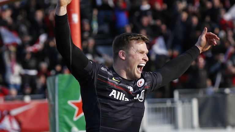 Chris Ashton of Saracens celebrates scoring a try during the European Rugby Champions Cup pool one match between Saracens and Munster