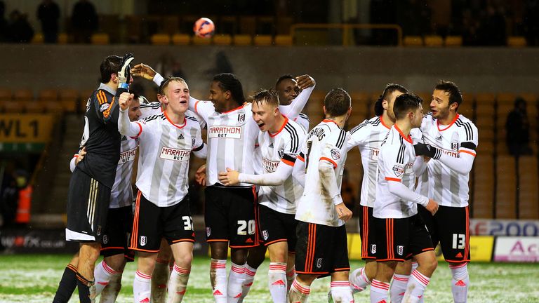 Fulham players celebrate victory.