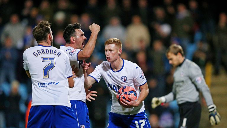SCUNTHORPE, ENGLAND - JANUARY 06:  Eoin Doyle (R) of Chesterfield is congratulated by teammates after scoring a goal from the penalty spot during the FA Cu