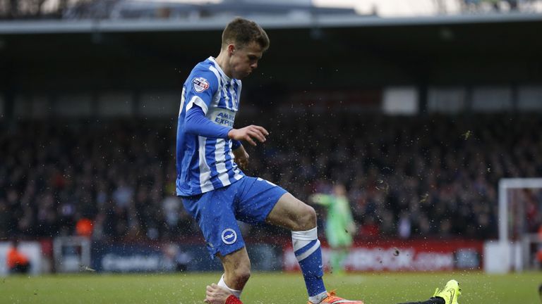 BRENTFORD, ENGLAND - JANUARY 03: Solly March of Brighton & Hove Albion is tackled by Tommy Smith of Brentford during the FA Cup Third Round match between B