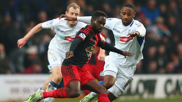 Nathan Dyer of Swansea City is closed down by Janoi Donacien of Tranmere