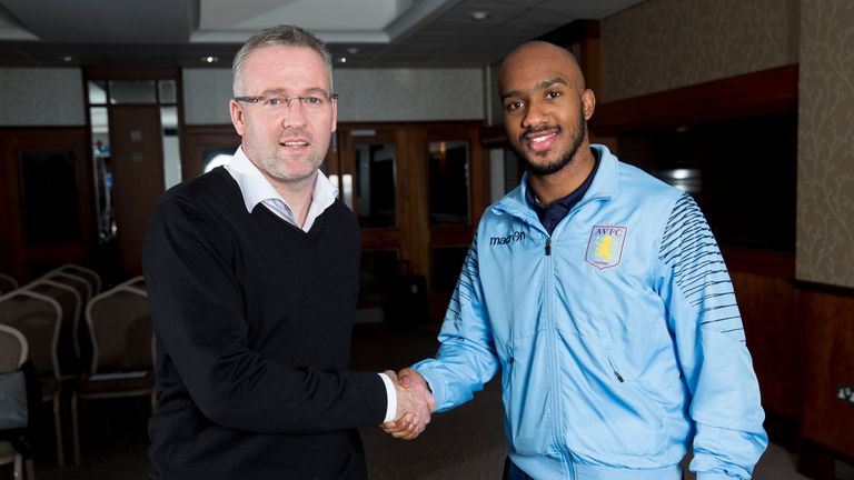 Fabian Delph of Aston Villa poses for a picture with Paul Lambert manager