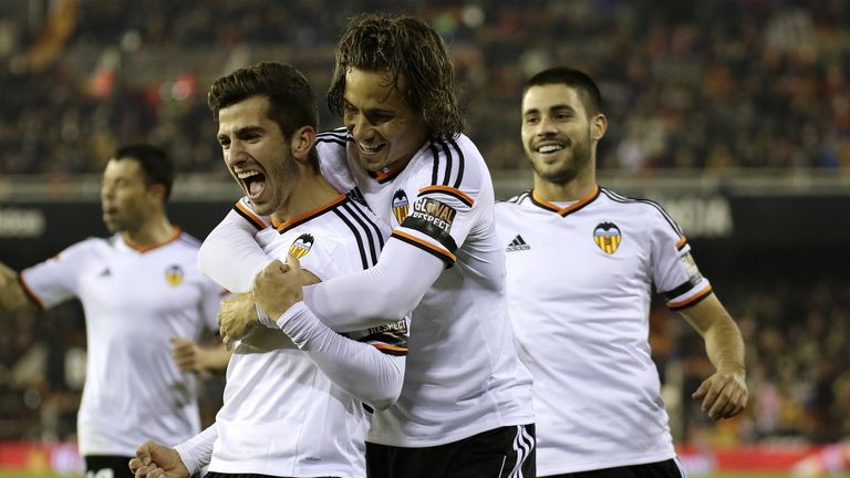 Valencia's defender Jose Gaya (left) celebrates a goal