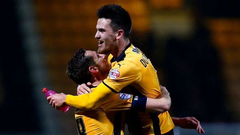 Ryan Donaldson of Cambridge United celebrates with team-mate Tom Champion after the FA Cup Fourth Round match