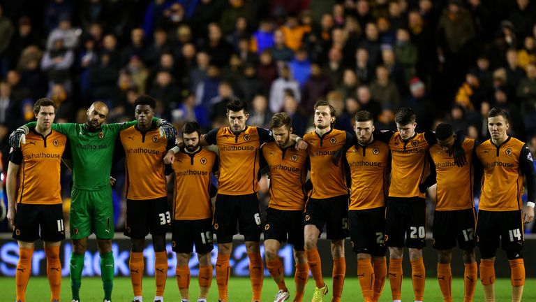 Wolves players observe a minute's silence for former owner Sir Jack Hayward before the FA Cup third round replay.