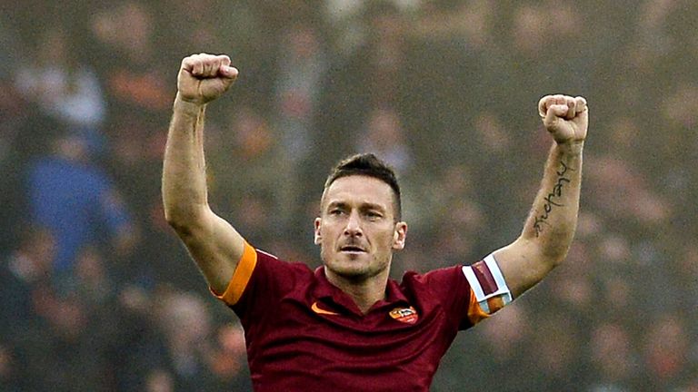 Roma's forward Francesco Totti celebrates after scoring  against Lazio