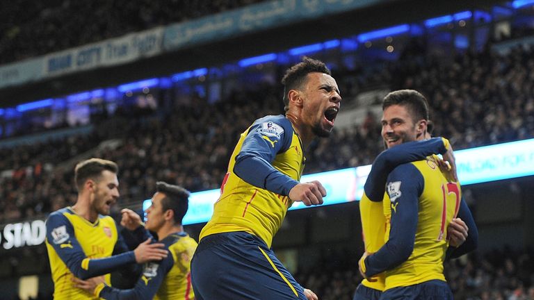 MANCHESTER, ENGLAND - JANUARY 18: (2ndR) Francis Coquelin celerbates the 2nd Arsenal goal, scored by (R) Olivier Giroud during the Barclays Premier League