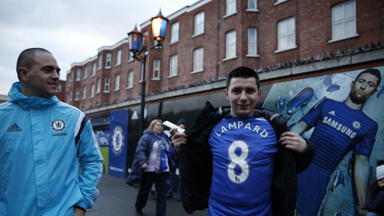 A Chelsea fan bears his shirt showing the name of Chelsea's former English midfielder Frank Lampard who now plays for Manchester City outside the ground 