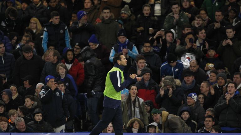 Manchester City's English midfielder Frank Lampard applauds the Chelsea fans as he warms up on the touchline during the match between Chelsea and Man City