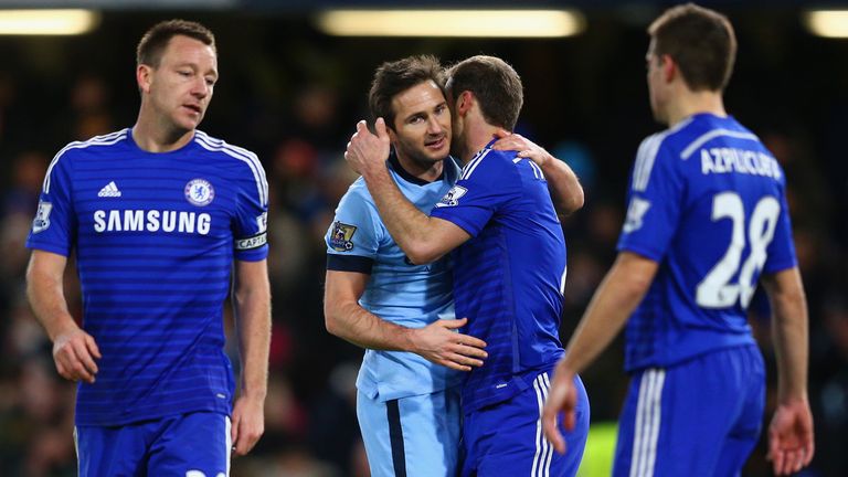 Frank Lampard of Manchester City embraces Branislav Ivanovic of Chelsea