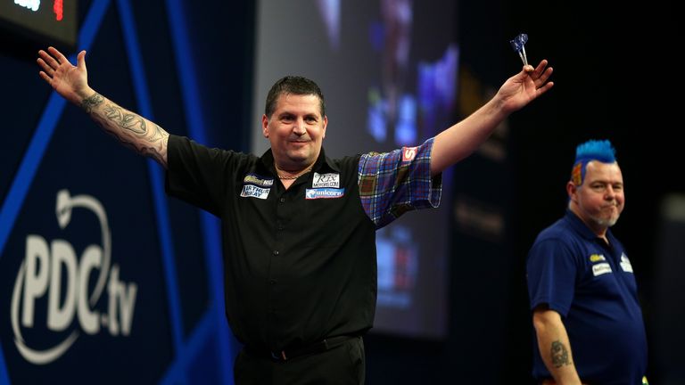 Gary Anderson of Scotland celebrates after winning his quarter final match against Peter Wright of Scotland 