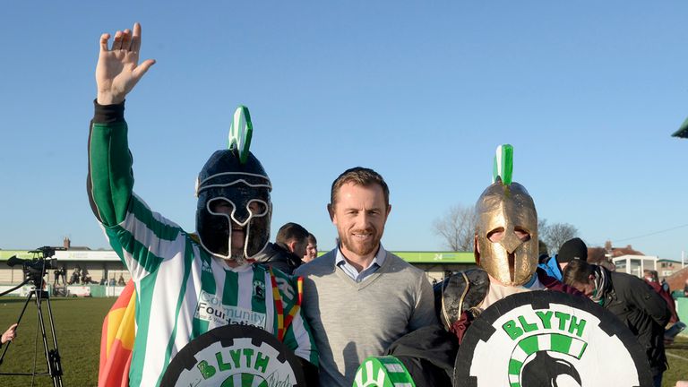 Birmingham City manager Gary Rowett poses with Blyth Spartans fans dressed up as Spartans on the pitch before the FA Cup Third Round match at Croft Park, B