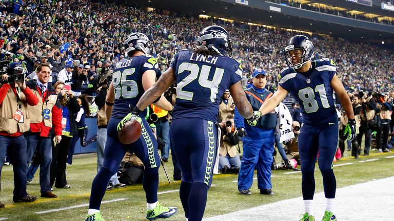 SEATTLE, WA - JANUARY 19:  Running back Marshawn Lynch #24 of the Seattle Seahawks celebrates with wide receiver Golden Tate #81 after Lynch scores on a 40
