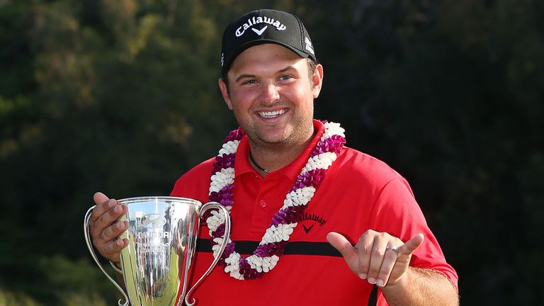 Patrick Reed poses with the winner's trophy after the final round of the Hyundai Tournament of Champions
