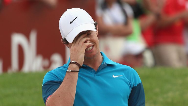 Rory McIlroy is also perplexed after his eagle attempt from a bunker at the last shaves the edge of the hole