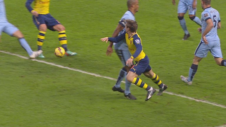 Vincent Kompany blocks off Nacho Monreal.