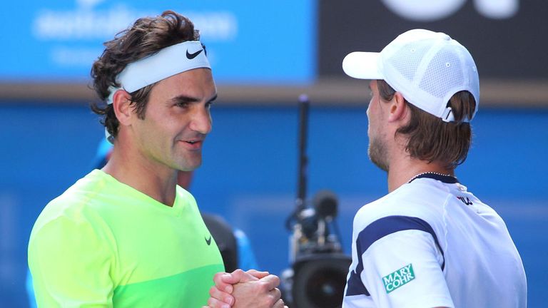 Roger Federer of Switzerland shakes hands with Andreas Seppi of Italy