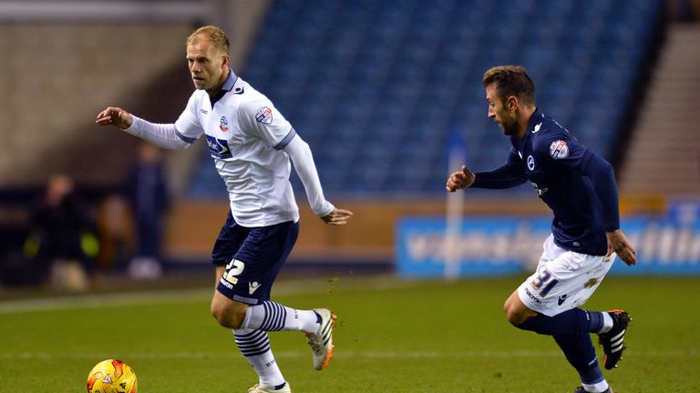 Eidur Gudjohnsen of Bolton and Angel of Millwall FC in action during the Sky Bet Championship match between Millwall and Bolton Wanderers at The Den.