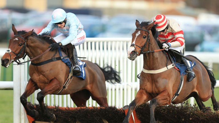 Glingerburn (right) ridden by Brian Harding jumps the last infront of Some Buckle ridden by Paddy Brennan to win The Cash Out on the Betdaq +app National H