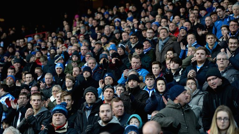 HUDDERSFIELD, ENGLAND - JANUARY 03:  Huddersfield fans watch on during the FA Cup Third Round match between Huddersfield Town and Reading at Galpharm Stadi