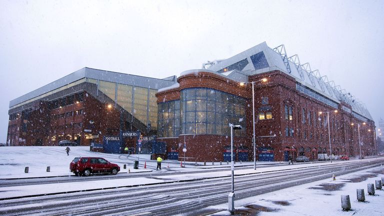 A general view of Ibrox Stadium in Glasgow as snow falls before the Scottish Championship match.