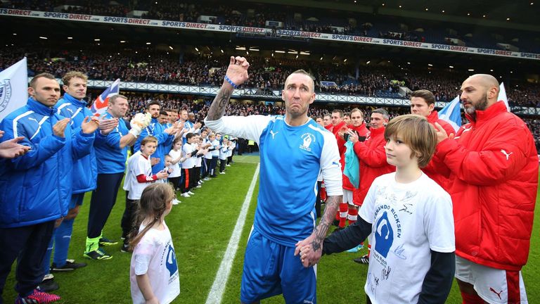 Fernando Ricksen greets the crowd before his tribute match at the Ibrox Stadium.